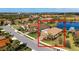 Gorgeous single Gathering home with a terra cotta roof, manicured lawn, and lake views, nestled in a desirable community at 209 Malina Ct, Nokomis, FL 34275