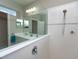 Bathroom featuring double sinks, large mirror, and walk-in shower at 209 Malina Ct, Nokomis, FL 34275