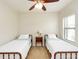 Bedroom featuring twin beds, a ceiling fan, and a window for natural light at 209 Malina Ct, Nokomis, FL 34275