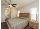 Bedroom with a ceiling fan, with ample natural light from windows and an ensuite bathroom at 209 Malina Ct, Nokomis, FL 34275