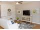 Bright living room featuring modern decor, stylish furniture, and decorative wall art at 209 Malina Ct, Nokomis, FL 34275