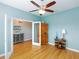 Office with neutral walls, wood floors, ceiling fan, and glass paneled french doors at 209 Malina Ct, Nokomis, FL 34275