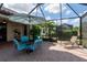 Covered brick patio with dining and lounge seating at 209 Malina Ct, Nokomis, FL 34275