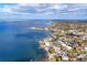A high-angle view of a coastal town featuring homes, waterways, and expansive water views at 295 North Dr, Englewood, FL 34223