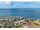 An aerial shot of a coastal neighborhood with beautiful waterways, homes, and stunning ocean views at 295 North Dr, Englewood, FL 34223