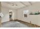 A bedroom featuring white walls, ceiling fan, and a window with outside view at 295 North Dr, Englewood, FL 34223