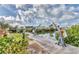 Image shows a concrete dock area with boat lift, perfect for waterfront living and boating enthusiasts at 295 North Dr, Englewood, FL 34223