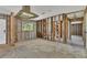 Exposed kitchen featuring stainless steel range hood, under renovation at 295 North Dr, Englewood, FL 34223