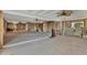 Large open living room with unfinished walls, ceiling fans, perfect for customization at 295 North Dr, Englewood, FL 34223