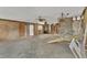 Renovation opportunity with exposed beams in this open-concept living space awaiting transformation at 295 North Dr, Englewood, FL 34223