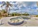 A large, spacious pool and spa with an appealing blue-tile design set by the waterfront at 295 North Dr, Englewood, FL 34223