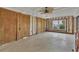 Room with unfinished walls, featuring ceiling fan and natural light at 295 North Dr, Englewood, FL 34223