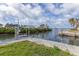 Waterfront with a dock and lush green landscape at 295 North Dr, Englewood, FL 34223