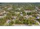 Wide aerial view showcases homes nestled among lush greenery, offering a serene, community atmosphere with mature trees at 3892 Alwood St, North Port, FL 34291