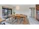 Dining room area with a modern light fixture and sliding doors to the backyard at 3892 Alwood St, North Port, FL 34291