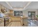 Bright kitchen featuring stainless steel appliances, a view to the outdoors, and an adjacent dining area at 3892 Alwood St, North Port, FL 34291