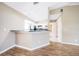 View from the living room shows the breakfast bar and the kitchen at 4525 Jaslo Ave, North Port, FL 34286