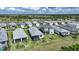 The aerial view displays several homes with screened lanais in a lakeside community at 6237 Fish Eagle Ct, Nokomis, FL 34275