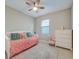 Cozy bedroom featuring a comfortable daybed, window with blinds, and a charming dresser, creating a serene atmosphere at 6237 Fish Eagle Ct, Nokomis, FL 34275