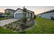 Charming single-story home featuring a two-car garage and well-maintained front yard with landscaping at 6237 Fish Eagle Ct, Nokomis, FL 34275