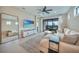 Bright living room with tile flooring, modern decor, and sliding doors to the patio at 6237 Fish Eagle Ct, Nokomis, FL 34275