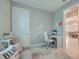 Bright office space featuring a white desk, chair, and comfortable seating area for a productive work environment at 6237 Fish Eagle Ct, Nokomis, FL 34275