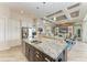 Modern kitchen with a large island with granite countertops open to the living room at 8200 Antwerp Cir, Port Charlotte, FL 33981