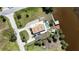 Beautiful aerial view of waterfront home featuring a pool and private dock for enjoying outdoor living at 8243 Pinetree Ln, Englewood, FL 34224