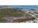 Stunning aerial view of a coastal community blending lush nature with convenient access to the ocean at 8243 Pinetree Ln, Englewood, FL 34224