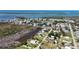 Aerial view showcases a charming waterfront community with access to beautiful ocean views and waterways at 8243 Pinetree Ln, Englewood, FL 34224