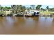 Scenic view of a private waterfront dock and gazebo, perfect for enjoying peaceful waterside relaxation at 8243 Pinetree Ln, Englewood, FL 34224