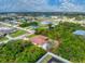 An aerial view of the property showcasing its proximity to commercial areas and nearby homes at 11453 Oceanspray Blvd, Englewood, FL 34224