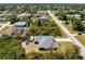 A single Gathering home with a detached storage shed and a long driveway is nestled within a lush, green neighborhood at 11453 Oceanspray Blvd, Englewood, FL 34224