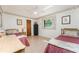 Bedroom with hardwood floors, neutral paint, and a ceiling fan, furnished with two twin beds at 11453 Oceanspray Blvd, Englewood, FL 34224