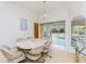 Bright dining room adjacent to the screened lanai; perfect for everyday meals and entertaining guests at 11453 Oceanspray Blvd, Englewood, FL 34224