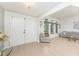 Spacious entryway featuring a bright foyer with large windows and a sofa at 11453 Oceanspray Blvd, Englewood, FL 34224