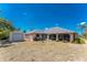 Spacious backyard with a storage shed, screened lanai and mature landscaping at 11453 Oceanspray Blvd, Englewood, FL 34224