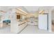 Bright kitchen with tile floors and plenty of cabinet space at 11453 Oceanspray Blvd, Englewood, FL 34224