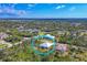 Picturesque aerial view of a cozy residential neighborhood surrounded by beautiful landscapes and lush greenery at 12028 Newgate Ave, Port Charlotte, FL 33981