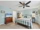 Light filled main bedroom featuring carpet floors and ceiling fan at 12028 Newgate Ave, Port Charlotte, FL 33981