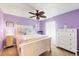 Bedroom with carpet floors, ceiling fan, and plenty of light at 12028 Newgate Ave, Port Charlotte, FL 33981