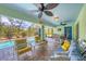 Inviting screened lanai featuring comfortable seating and views of the sparkling pool at 12028 Newgate Ave, Port Charlotte, FL 33981