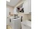 Functional laundry room with washer, dryer and utility sink at 12028 Newgate Ave, Port Charlotte, FL 33981