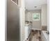 Bathroom featuring double sink vanity, framed shower, and weathered wood flooring at 1313 Buereau Rd, Englewood, FL 34223