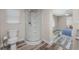 Bathroom featuring a glass shower stall, toilet and wood-look flooring at 1313 Buereau Rd, Englewood, FL 34223