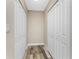 Hallway with side by side closets and neutral walls at 1313 Buereau Rd, Englewood, FL 34223