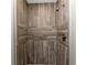 Detailed view of a tiled shower with wood-look tile and a chrome shower head at 1313 Buereau Rd, Englewood, FL 34223