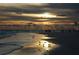 Scenic beach view at sunset, showcasing the tranquil shoreline and golden reflections on the water at 1320 Bayshore Dr, Englewood, FL 34223
