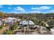 A beautiful single-story home with a metal roof, blue shutters, and well-maintained landscaping at 1320 Bayshore Dr, Englewood, FL 34223