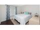 Comfortable bedroom with wood floors, window with curtains, and comfortable queen bed at 13360 Foresman Blvd, Port Charlotte, FL 33981